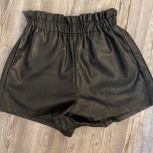 Black faux leather shorts